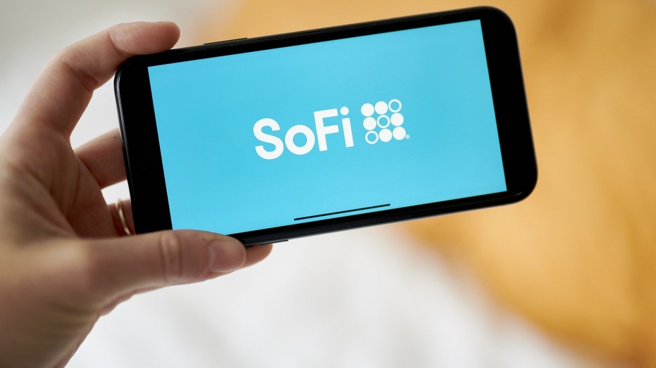 The logo for Social Finance (SoFi) on a smartphone