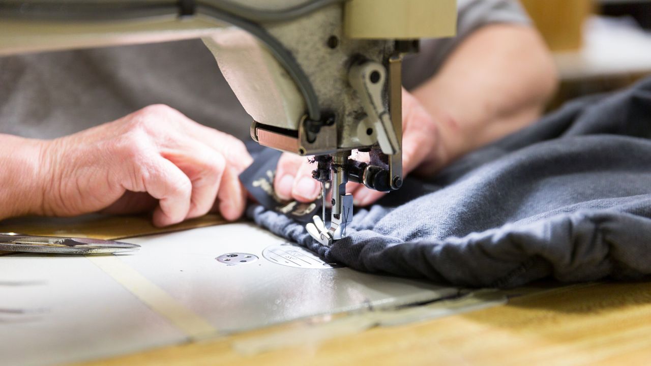 An employee is sewing at the Johnson, Vermont, production facility of The Vermont Flannel Company.