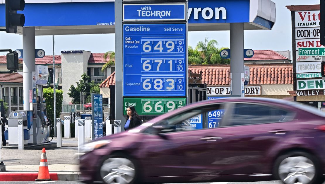 A sign displays the price of gas at more than 6 USD per gallon, at a petrol station in Alhambra, California, on September 18, 2023. Oil prices hit a 10-month high on September 15, 2023, after oil supply cuts in Saudi Arabia and Russia, as well as deadly flooding in Libya, have raised oil prices close to 100 USD per barrel.