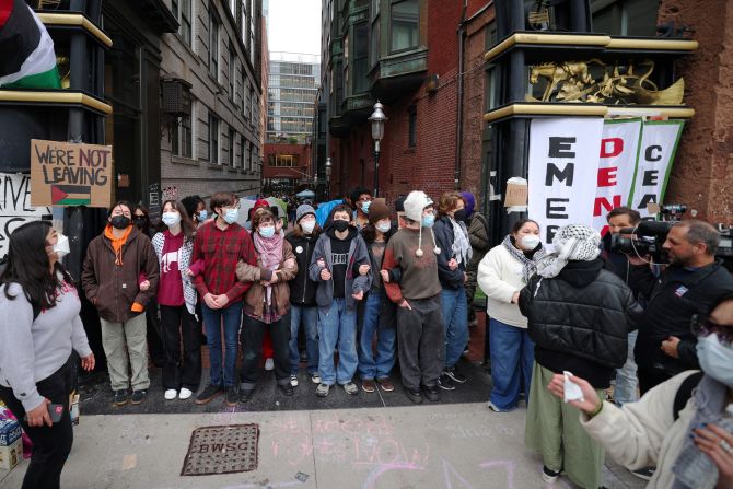 Protesters link arms at Emerson College in Boston on April 24.